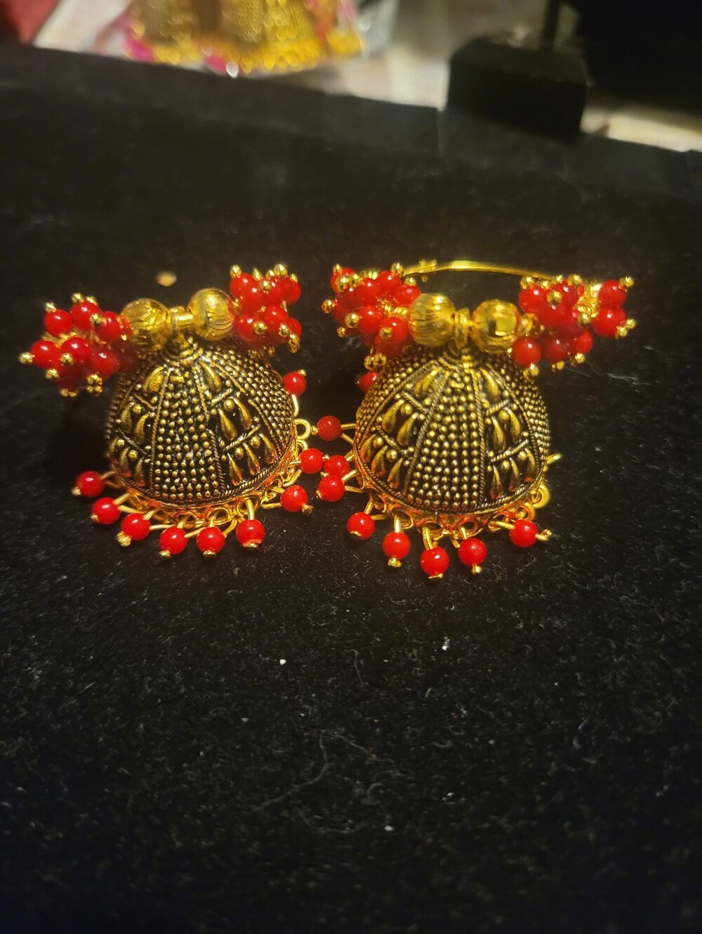 Gold-Tone Jhumka Earrings with Red Bead Accents